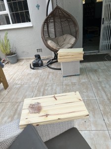 Piles of pine boards wait to be sanded